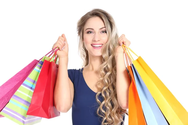 Frau mit Einkaufstaschen auf weißem Hintergrund — Stockfoto