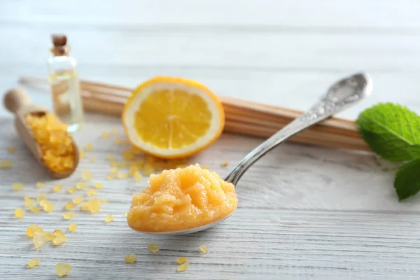 Spoon with orange scrub — Stock Photo, Image