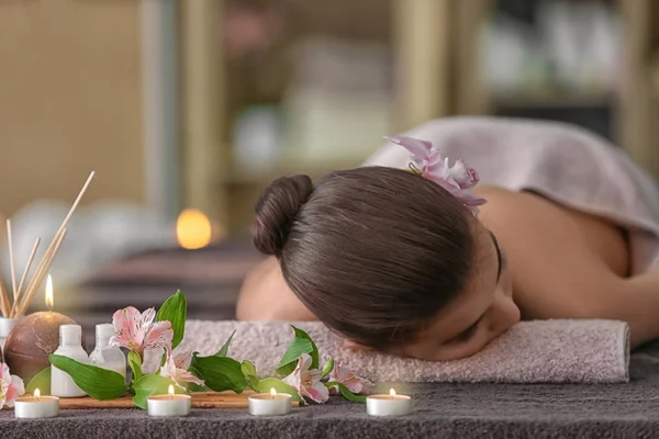 Vrouw liggend op een massagetafel — Stockfoto