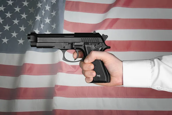 Male hand holding firearm — Stock Photo, Image