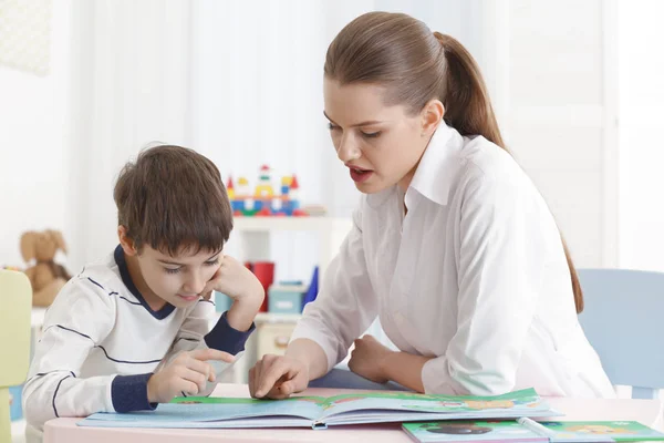 Cute little boy reading book — Stock Photo, Image