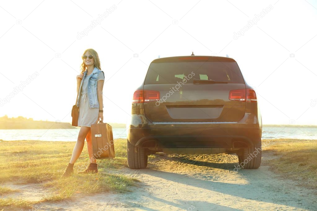 young woman near car