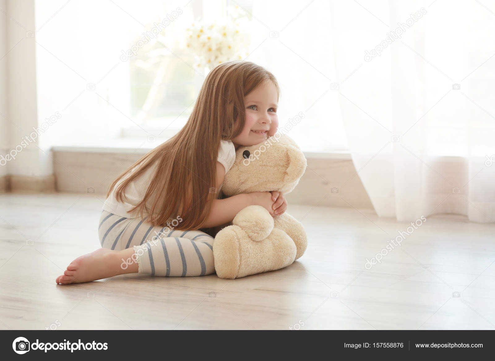 little girl with teddy