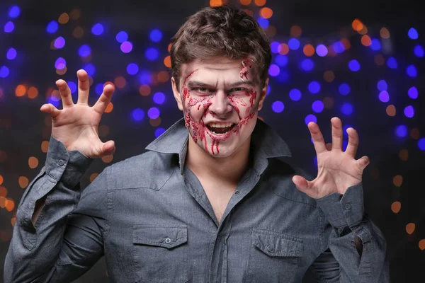 Young man with Halloween makeup at party — Stock Photo, Image