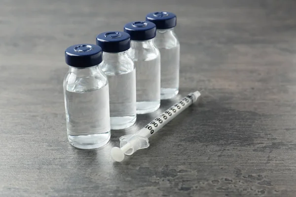 Vaccine in vials with syringe — Stock Photo, Image