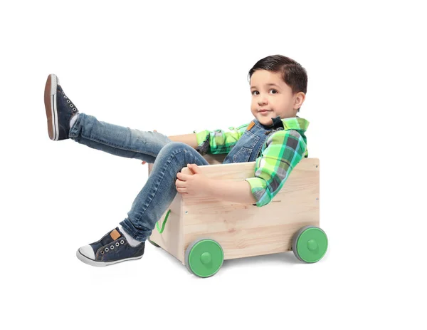 Cute little boy with wooden cart on white background — Stock Photo, Image