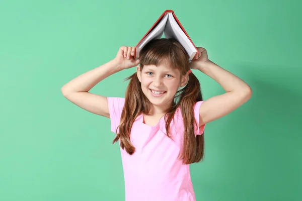 Pretty little girl with book — Stock Photo, Image