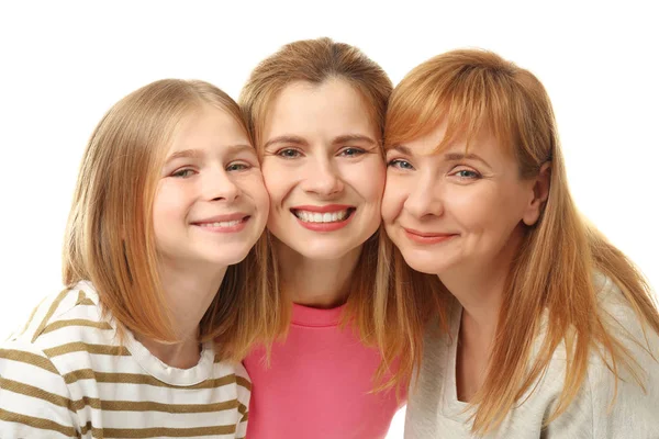 Mujer joven feliz con su madre y su hija sobre fondo blanco — Foto de Stock