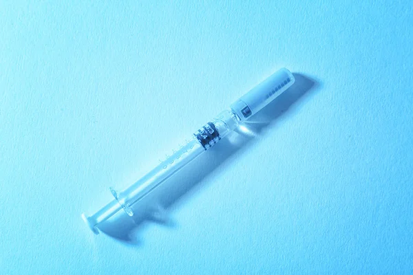 Medical syringe on table — Stock Photo, Image