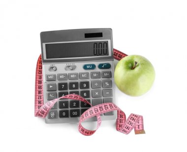 Hesap makinesi ve ölçüm bandı ile elma 