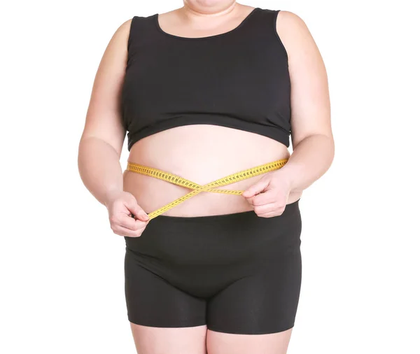 Толстая взрослая женщина с измерительной лентой — стоковое фото