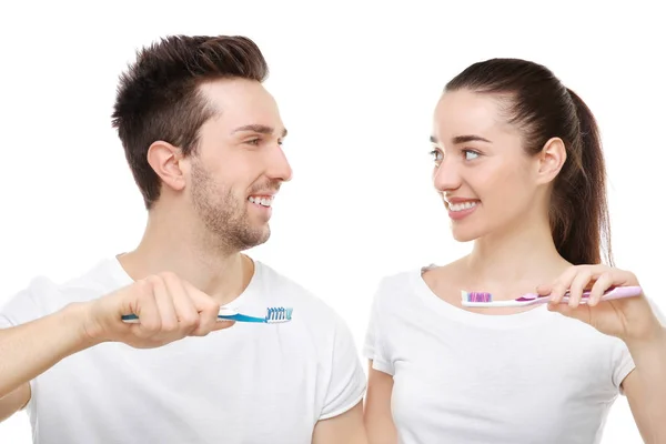 Happy couple brushing teeth — Stock Photo, Image