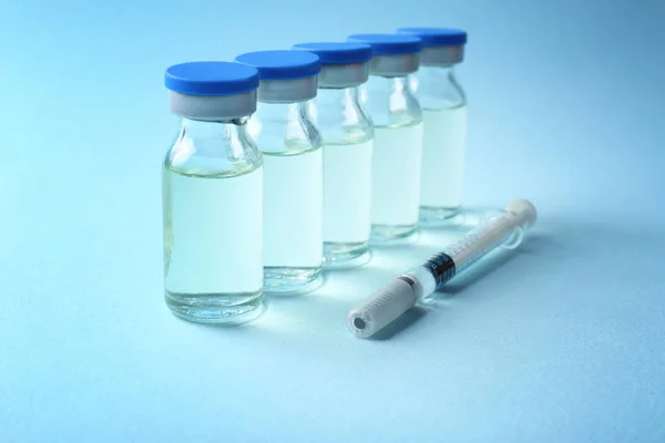 Vaccine in vials with syringe — Stock Photo, Image