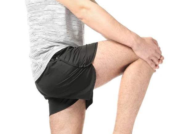 Mand, der lider af smerter i benet - Stock-foto