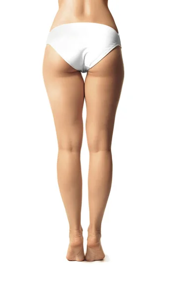 Junge Frau im Bikini auf weiß — Stockfoto