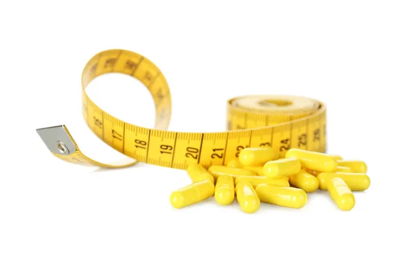 Suplementy Weight loss i taśma pomiarowa — Zdjęcie stockowe