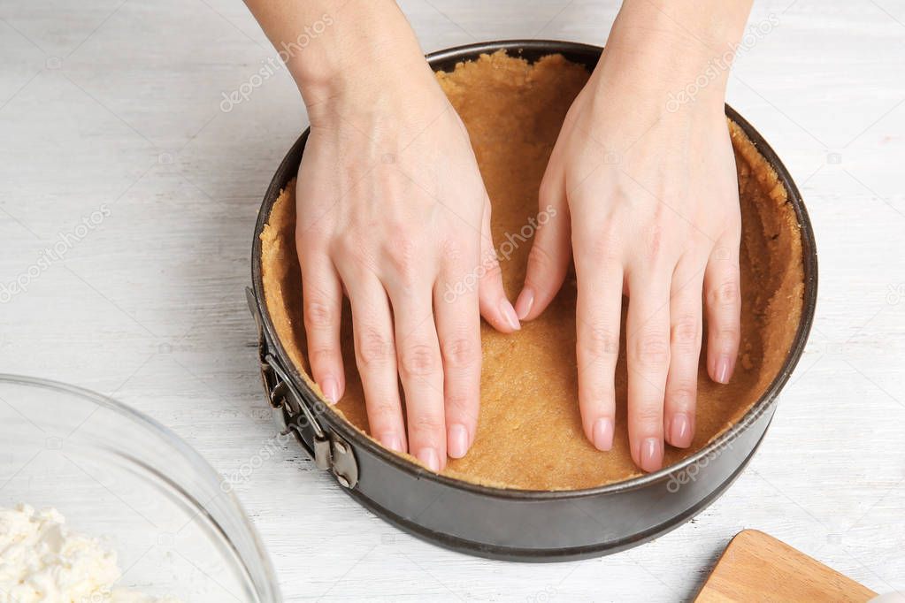 Woman making cheesecake 