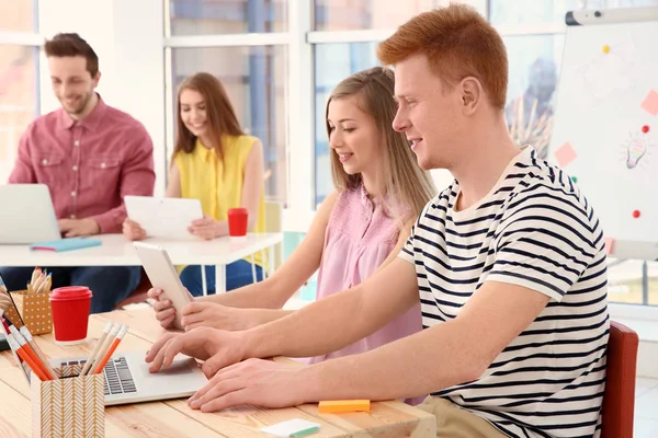 Young people working with laptops in office — Stock Photo, Image