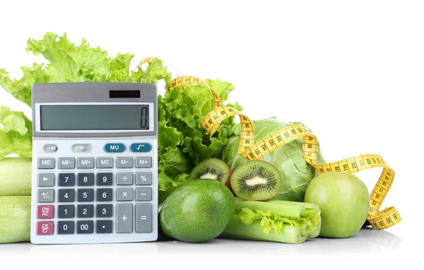 Овощи и фрукты с калькулятором и измерительной лентой — стоковое фото