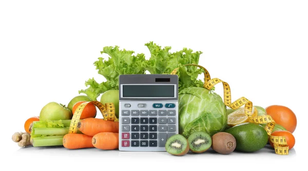 Zöldségek és gyümölcsök a számológép és a mérőszalag — Stock Fotó