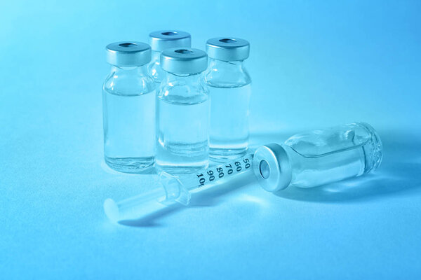 Vaccine in vials with syringe