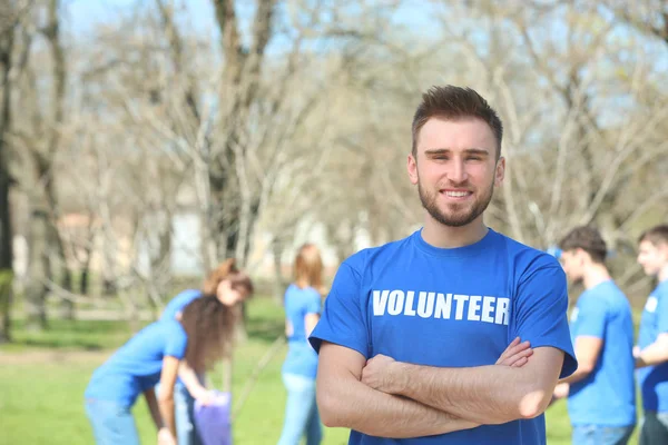 Handsome young volunteer outdoors — Stock Photo, Image