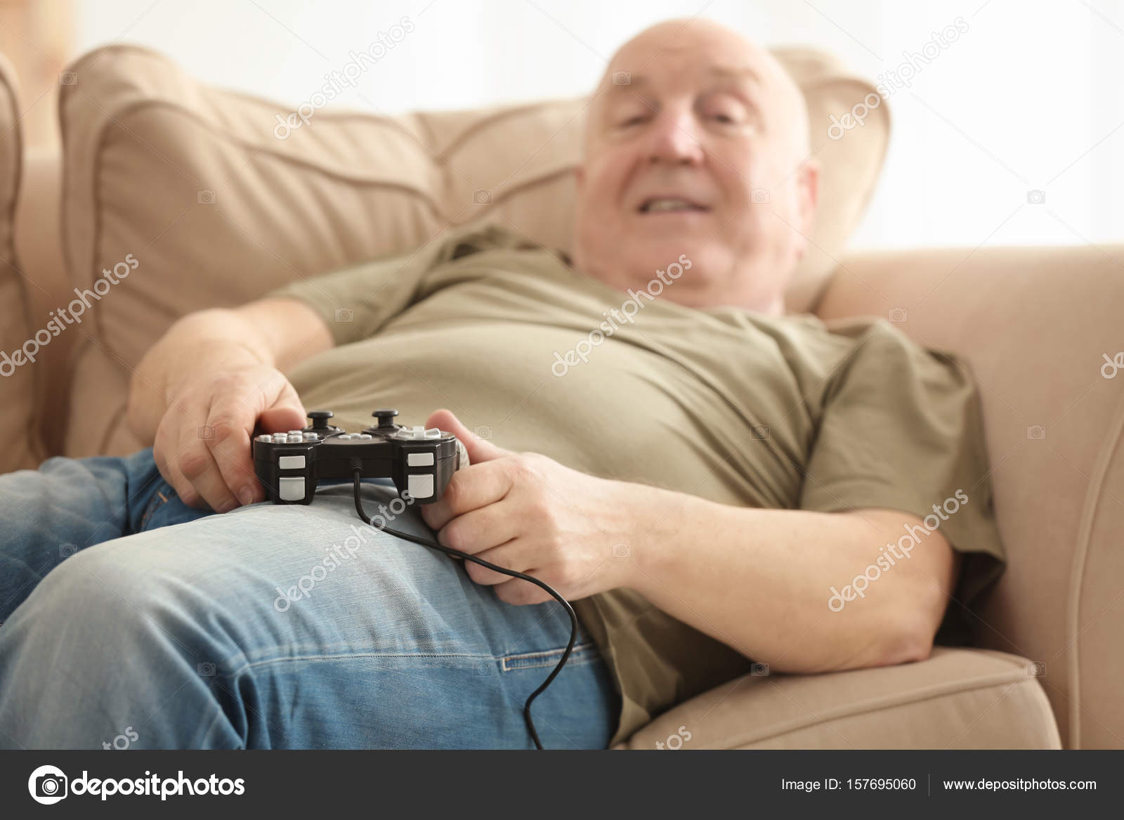 50+ Man Playing Video Game With Girlfriend Who Lying On The Sofa Stock  Photos, Pictures & Royalty-Free Images - iStock