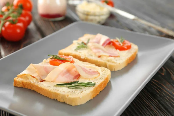 Tasty toasts with bacon for breakfast — Stock Photo, Image