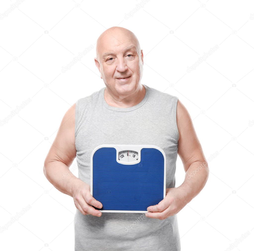 Fat senior man with scales on white background. Weight loss concept
