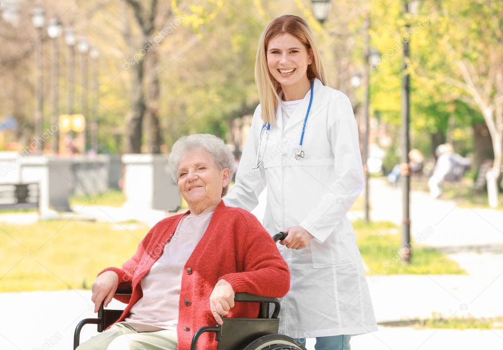 nurse and disabled elderly woman 