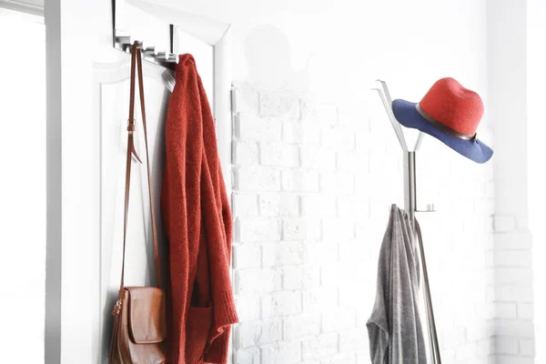 Hanging clothes on door — Stock Photo, Image