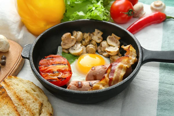 Frying pan with tasty egg, bacon and mushrooms — Stock Photo, Image