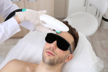 man getting laser epilation
