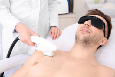 man getting laser epilation