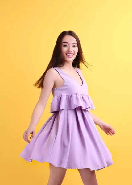 young woman in lilac dress