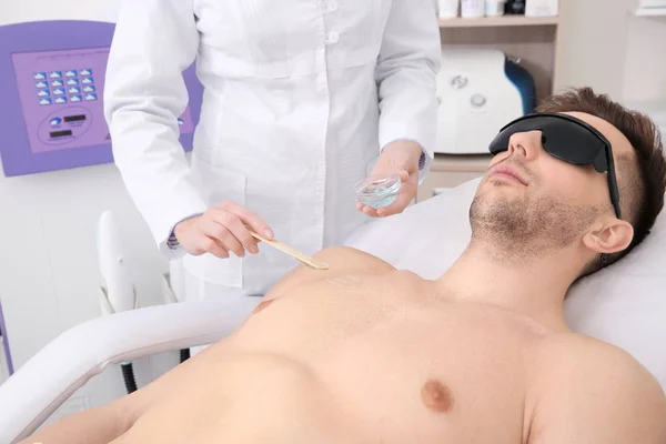 Man getting laser epilation — Stockfoto