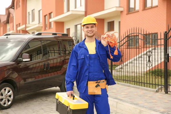 Smiling electrician with bunch of wires — Stock Photo, Image