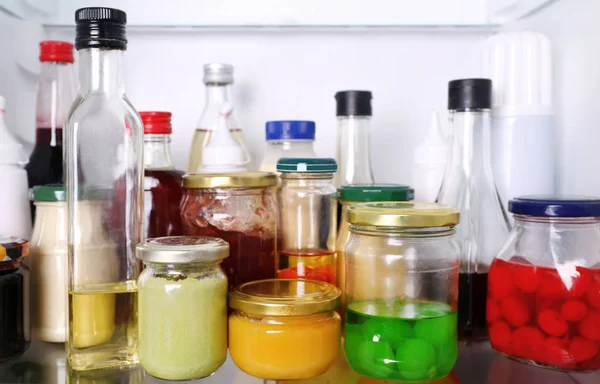 Different sauces in fridge — Stock Photo, Image