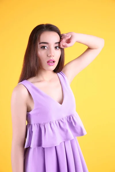 young woman in lilac dress