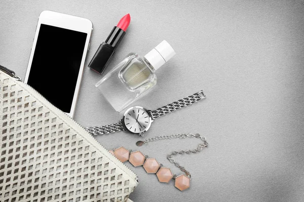 Cosmetics with perfume and phone — Stock Photo, Image