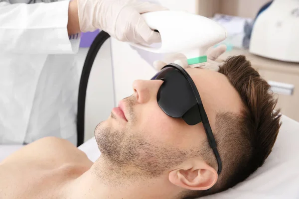 Man getting laser epilation — Stockfoto