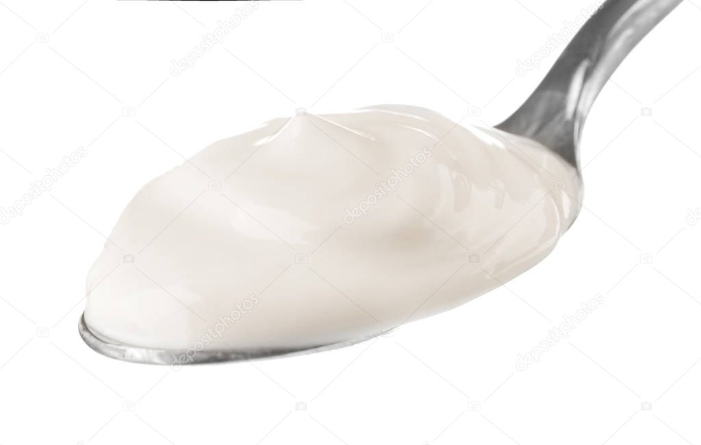 Spoon with delicious yogurt 