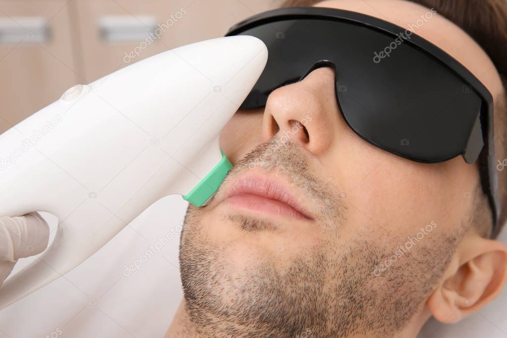 man getting laser epilation