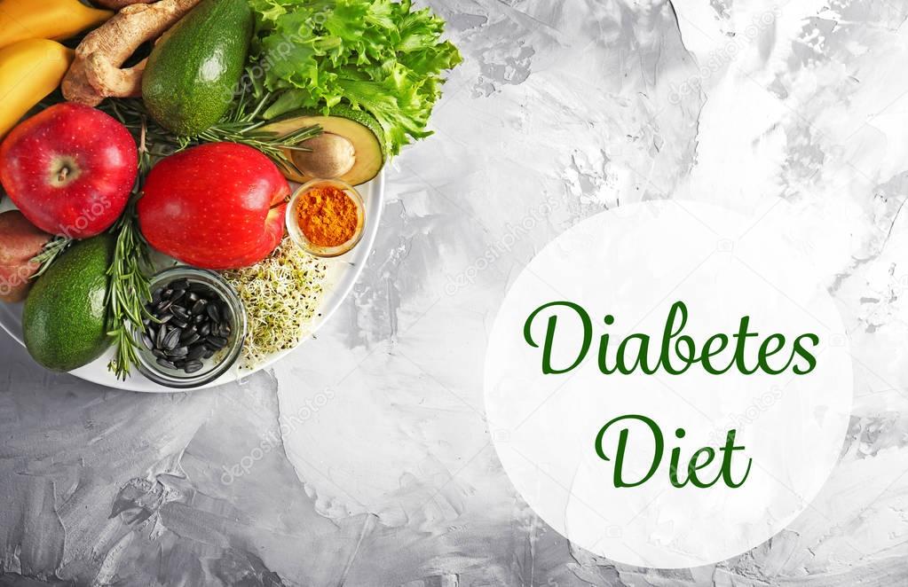 Text DIABETES DIET and healthy food on textured background ...
