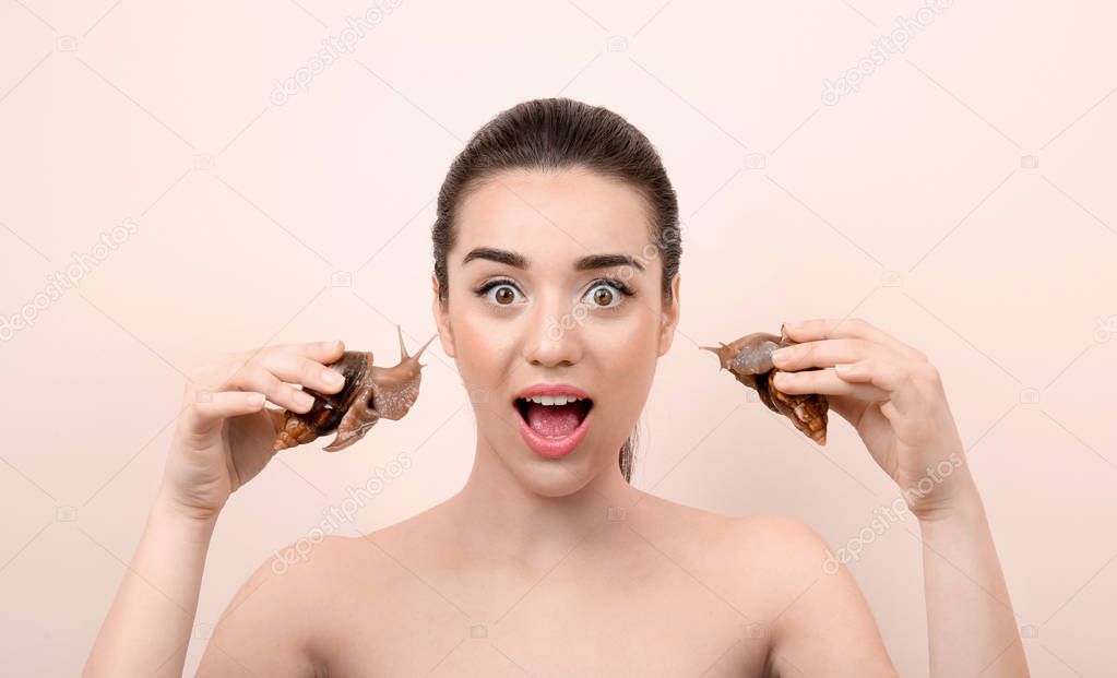 young woman with giant Achatina snails