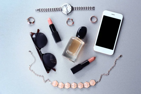 accessories with cosmetics and phone