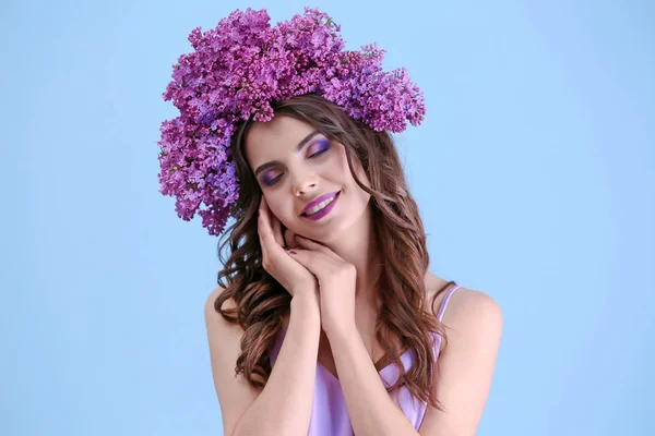 Woman in wreath of lilac — Stock Photo, Image