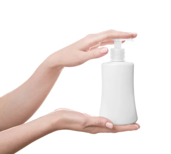 Mãos com garrafa de produto cosmético — Fotografia de Stock