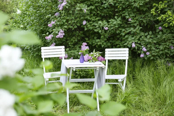 Lilac flowers on table
