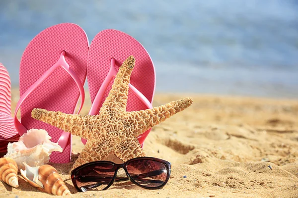 Beach accessories on sand — Stock Photo, Image